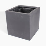 A square black fiberstone planter pot with an open top, shown at a three-quarter angle on a white background.