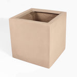 A square fiberstone planter pot in a warm sandy beige color, shown from a three-quarters perspective on a white background.