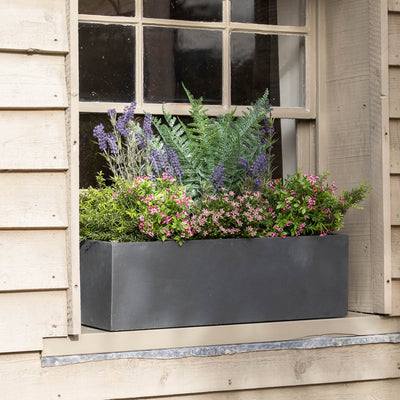 Window box with flowers on a wooden building