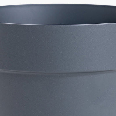 Close-up of a dark gray pot with a subtle texture.