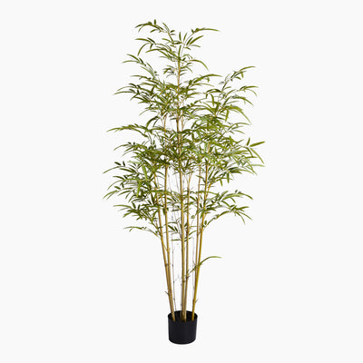 Artificial bamboo plant in a pot on a white background