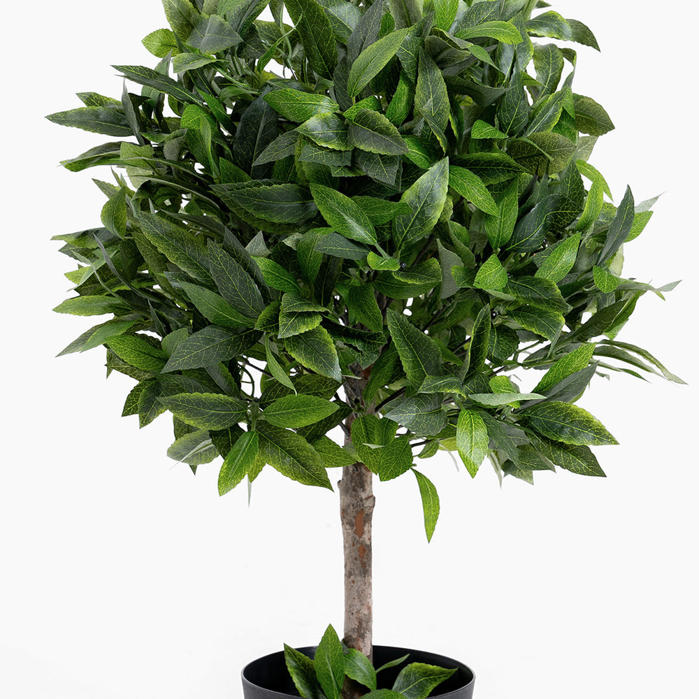 Artificial potted plant with green leaves on a white background