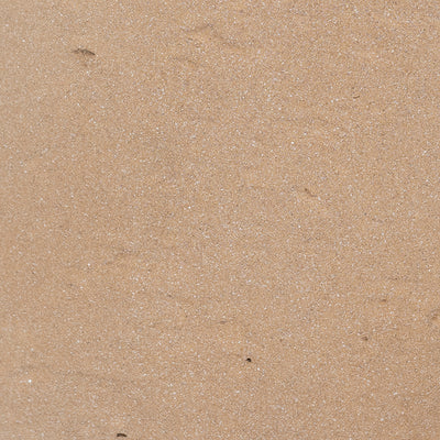 Close-up of beige sand texture
