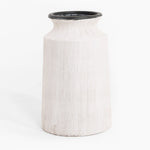 White textured vase with black rim on a white background