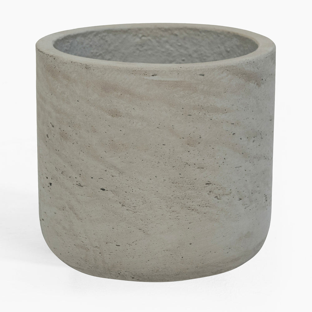 Concrete pot with textured surface on a white background
