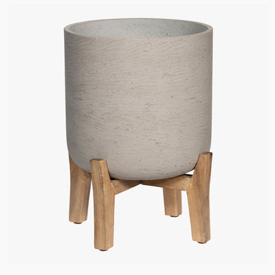 Gray textured planter with wooden stand on a white background