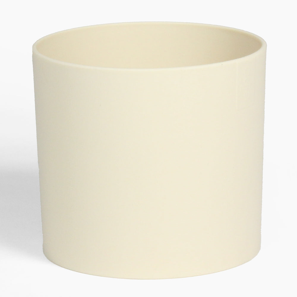 Beige ceramic planter on a white background