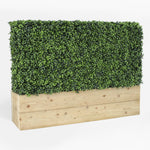 Artificial green wall with wooden base on a white background