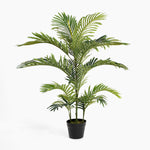 Potted artificial palm plant on a white background
