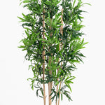 Artificial bamboo plant with green leaves on a white background