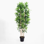Potted artificial bamboo plant on a white background