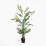Potted artificial palm plant on a white background