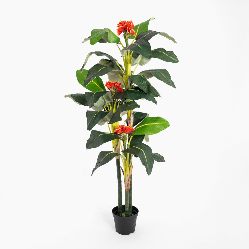 Artificial potted plant with red flowers and green leaves on a white background