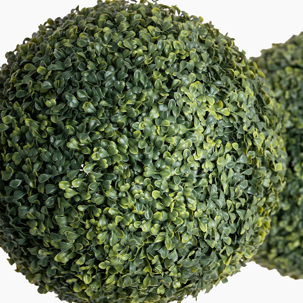 Artificial green bush ball on a white background