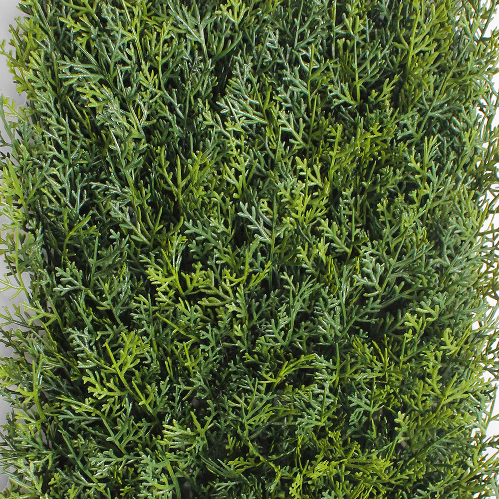 Artificial green bush on a white background