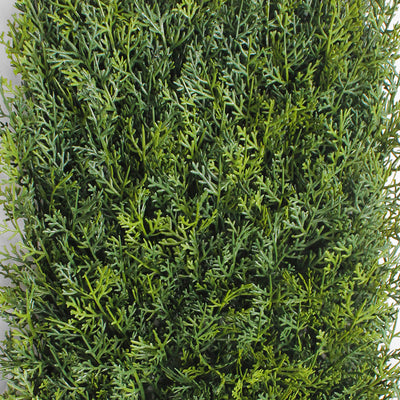 Artificial green bush on a white background