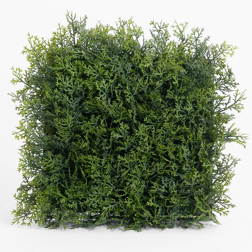 Square piece of artificial greenery on a white background