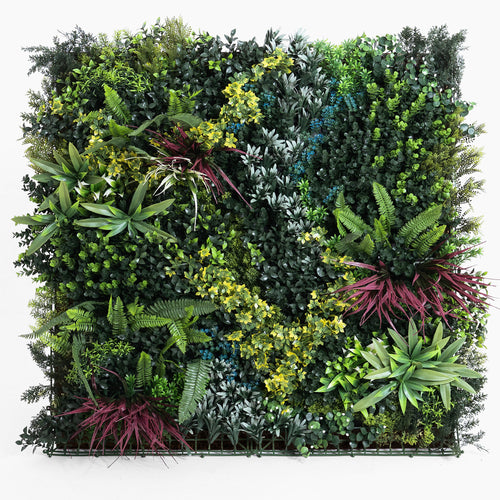 Artificial vertical garden wall with various green plants on a white background