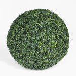 Artificial boxwood ball on a white background