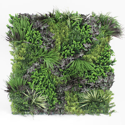 Artificial vertical garden wall with various green plants on a white background