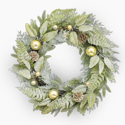 Decorative wreath with green leaves, gold ornaments, and pinecones on a white background