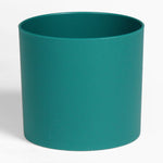 Teal cylindrical pot on a white background