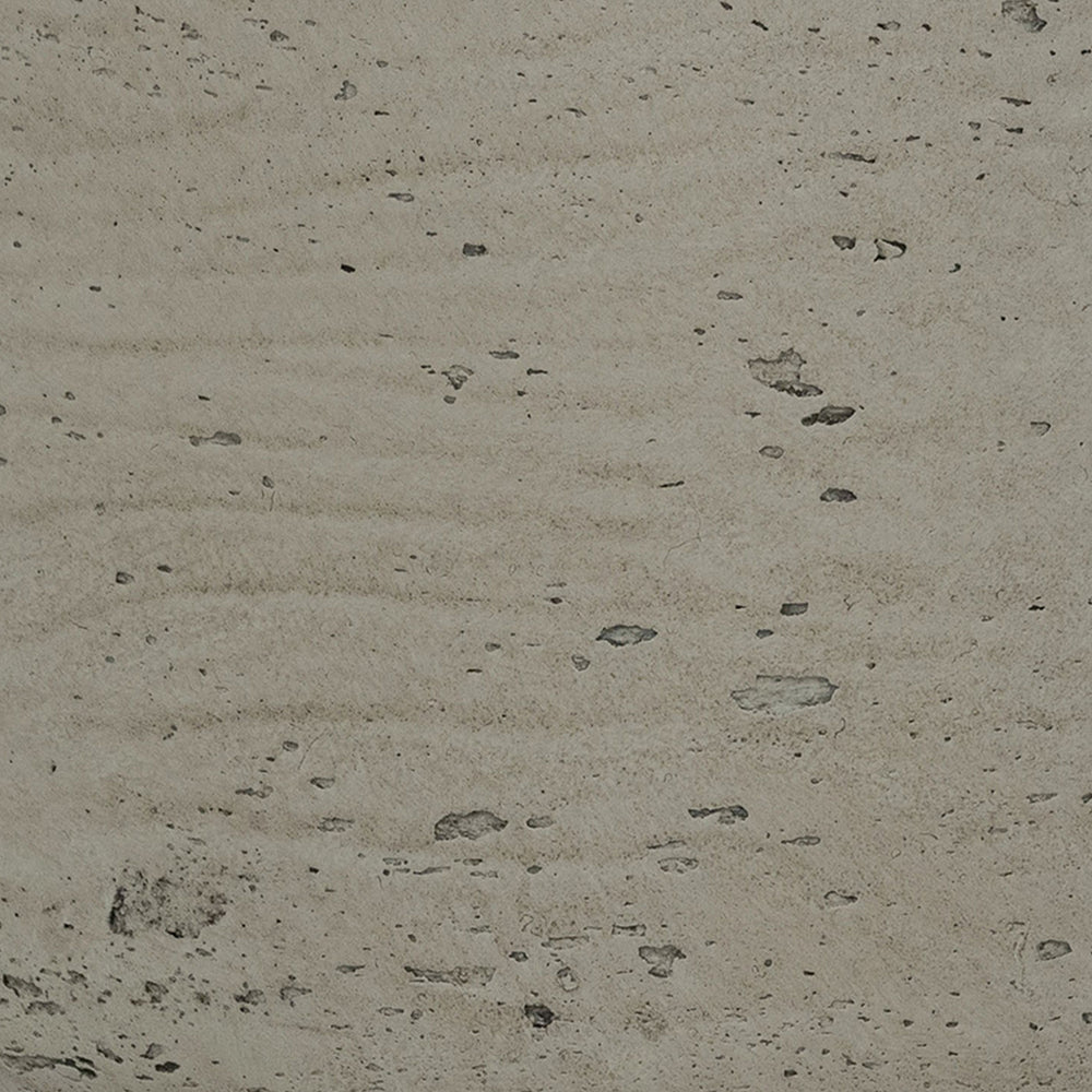Close-up of a textured concrete surface with small stones and imperfections.