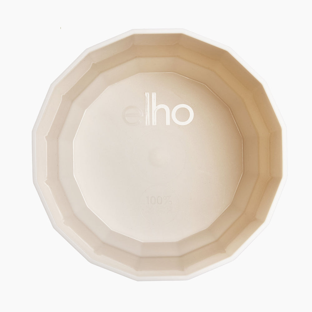 Light pink planter opening with 'elho' branding on the inside, on a white background