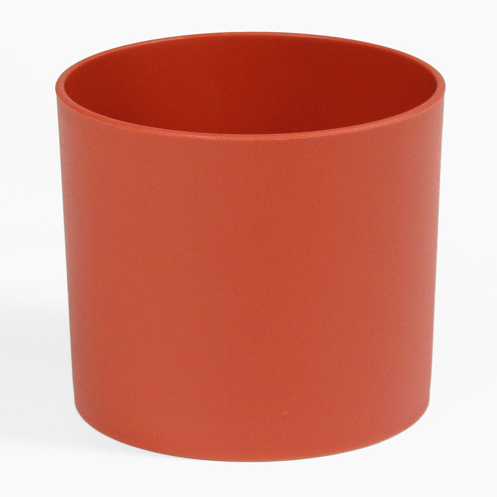 Red cylindrical pot on a white background