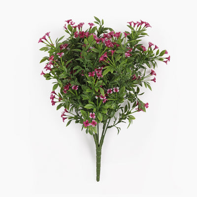 An artificial floral arrangement featuring clusters of small pink flowers with green leaves on a stem, photographed against a plain white background.