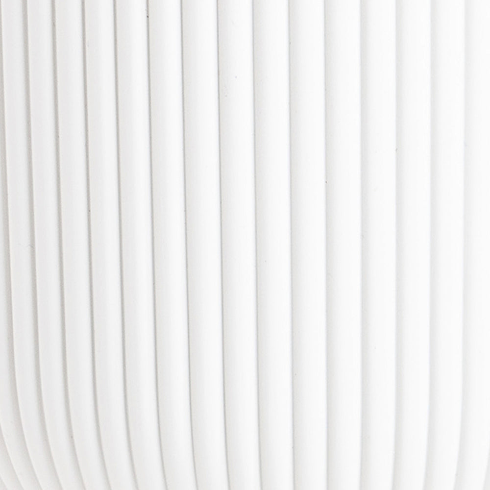White curtain with vertical pleats on a white background