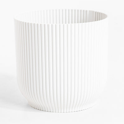 White ribbed vase on a white background
