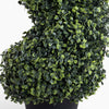 Artificial topiary ball plant in a pot on a white background