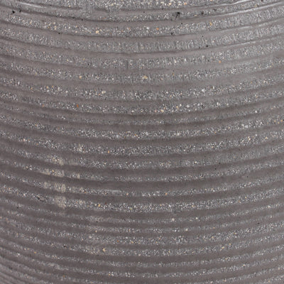 Close-up of a ribbed gray textured ficonstone surface with horizontal grooves and fine speckled material.