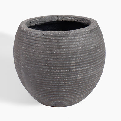A round, dark gray textured planter pot with horizontal grooved lines and a speckled finish, shown on a clean white background.