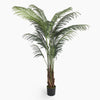 Potted artificial palm plant on a white background