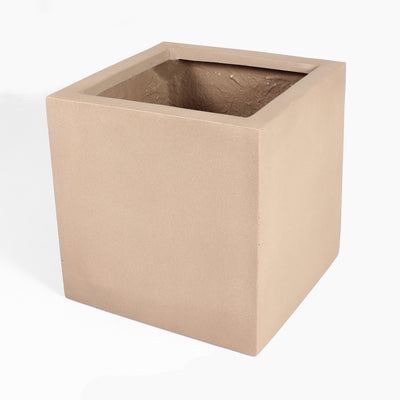 A square fiberstone planter pot in a warm sandy beige color, shown from a three-quarters perspective on a white background.