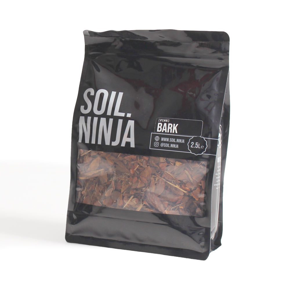 A 2.5L black stand-up pouch of Soil Ninja Bark mulch, featuring a clear window showing brown bark pieces inside, set against a plain white background.