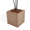 A square concrete planter in a warm taupe-brown color, containing a tree trunck with dark brown branches and reddish-brown wood chips, shown on a white background.