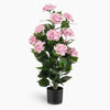 Artificial shrub with pink hydrangeas on a white background