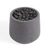 A dark gray concrete planter pot filled with smooth black decorative stones, shown on a clean white background.