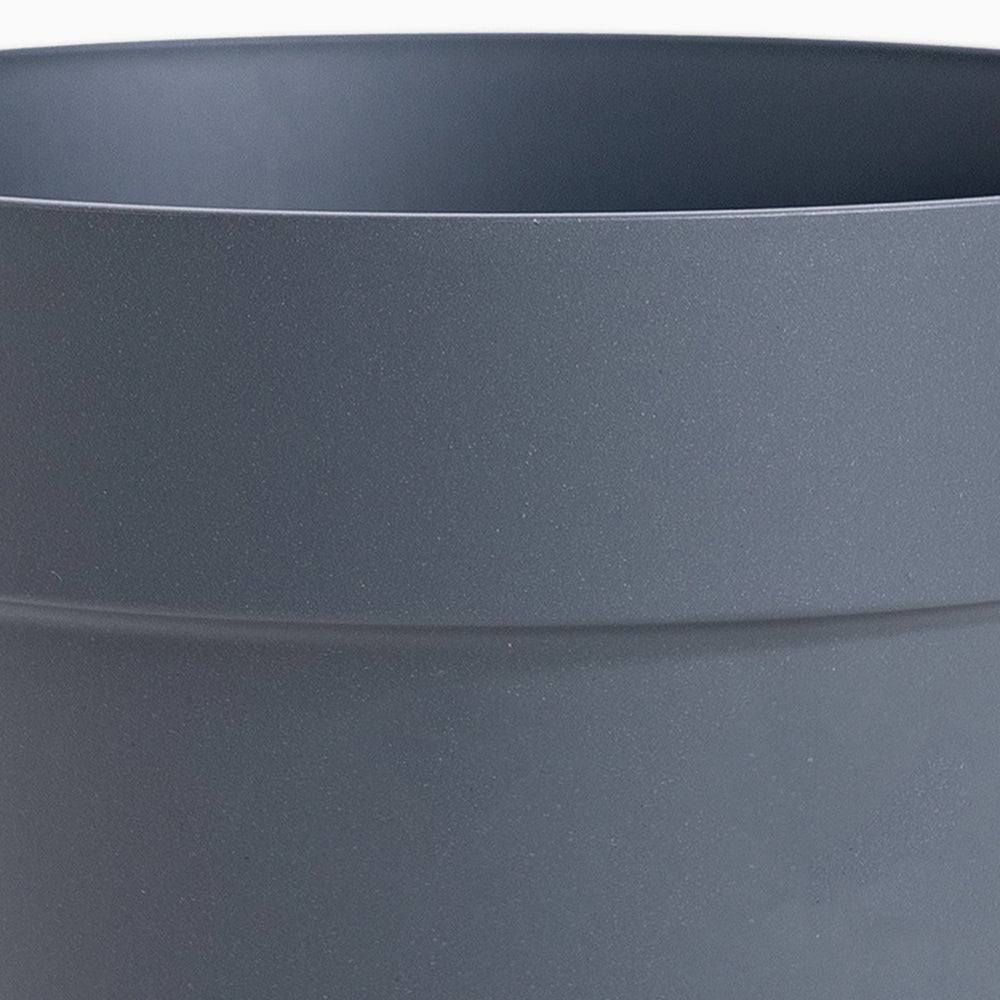 Close-up of a dark gray pot with a subtle texture.