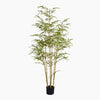 Artificial bamboo plant in a pot on a white background