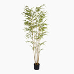 Artificial bamboo plant in a pot on a white background