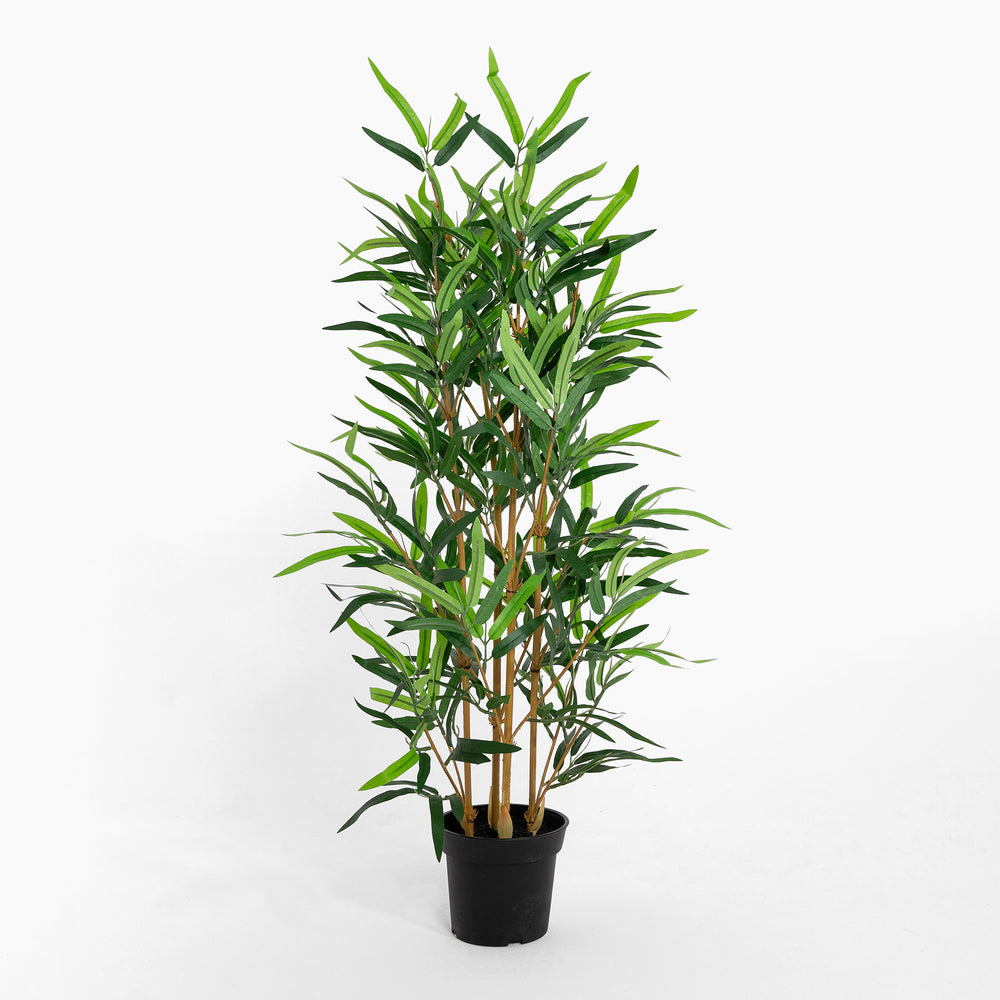 Potted artificial bamboo plant on a white background