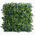Artificial green wall panel with a grid on a white background