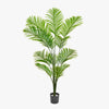 Potted artificial palm plant on a white background