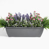Artificial pink wild flower window box arrangement
