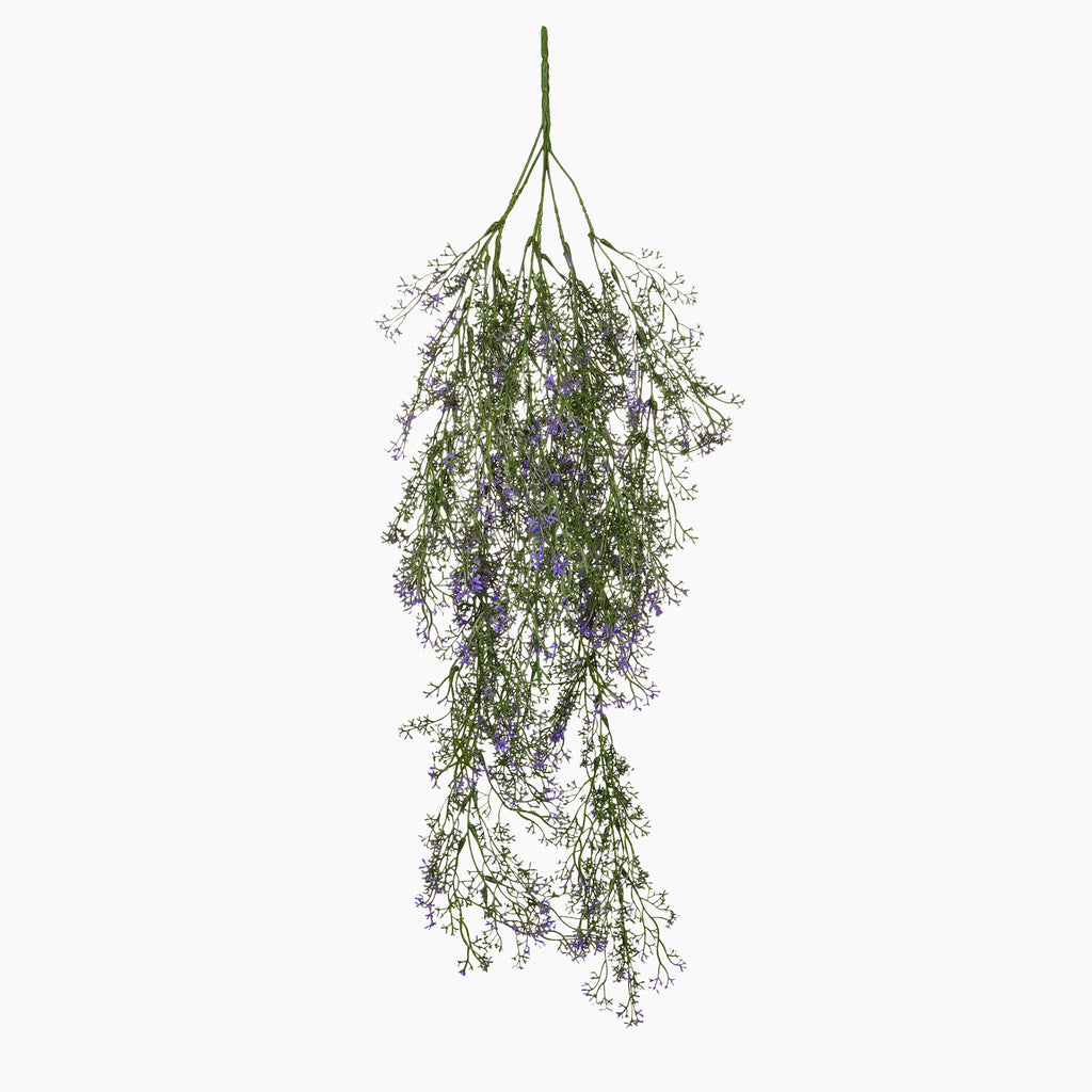 Hanging bundle of greenery with small purple flowers on a white background