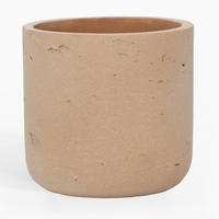 Beige ceramic planter on a white background